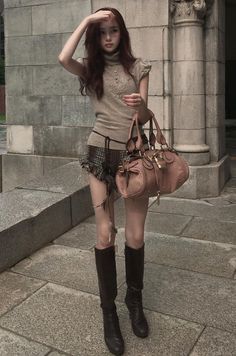 Woman in a turtleneck top and plaid skirt with a handbag outdoors