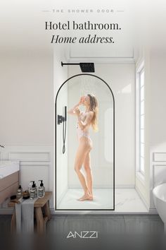 Woman in a swimsuit showering in a modern bathroom