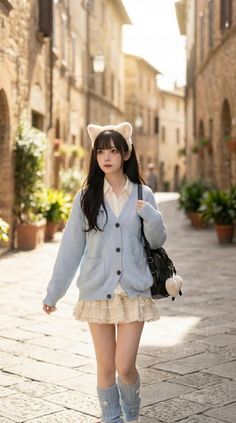 Woman with cat ears headband and mini skirt walking on a cobblestone street
