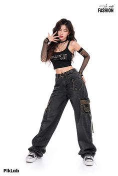 Woman in a black crop top and cargo pants with fishnet gloves on a white background