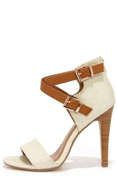 High heel shoe with ankle straps and snakeskin texture on a white background