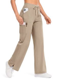 Person wearing khaki wide-leg pants with cargo pockets and white sneakers