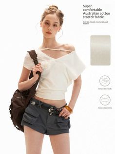 Woman in an off-shoulder top and cargo shorts with a backpack