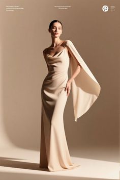 Woman in an elegant cream evening gown with a draped neckline in a studio