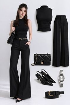 Woman in a black sleeveless top and wide leg pants with matching accessories