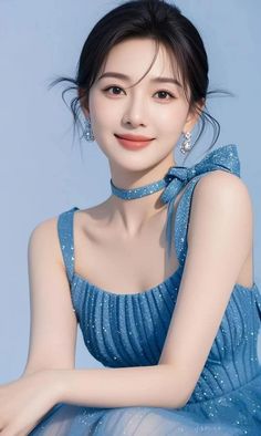 Woman in a sparkling blue dress with a matching choker and updo