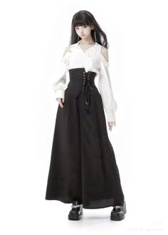 Woman with long black hair wearing a white shirt, corset, and wide leg pants