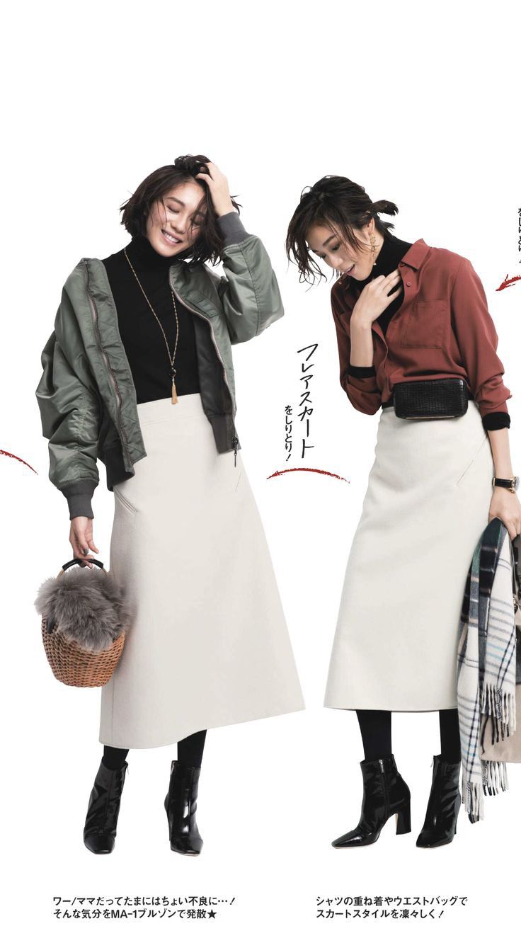 Two women in stylish outfits featuring midi skirts and ankle boots
