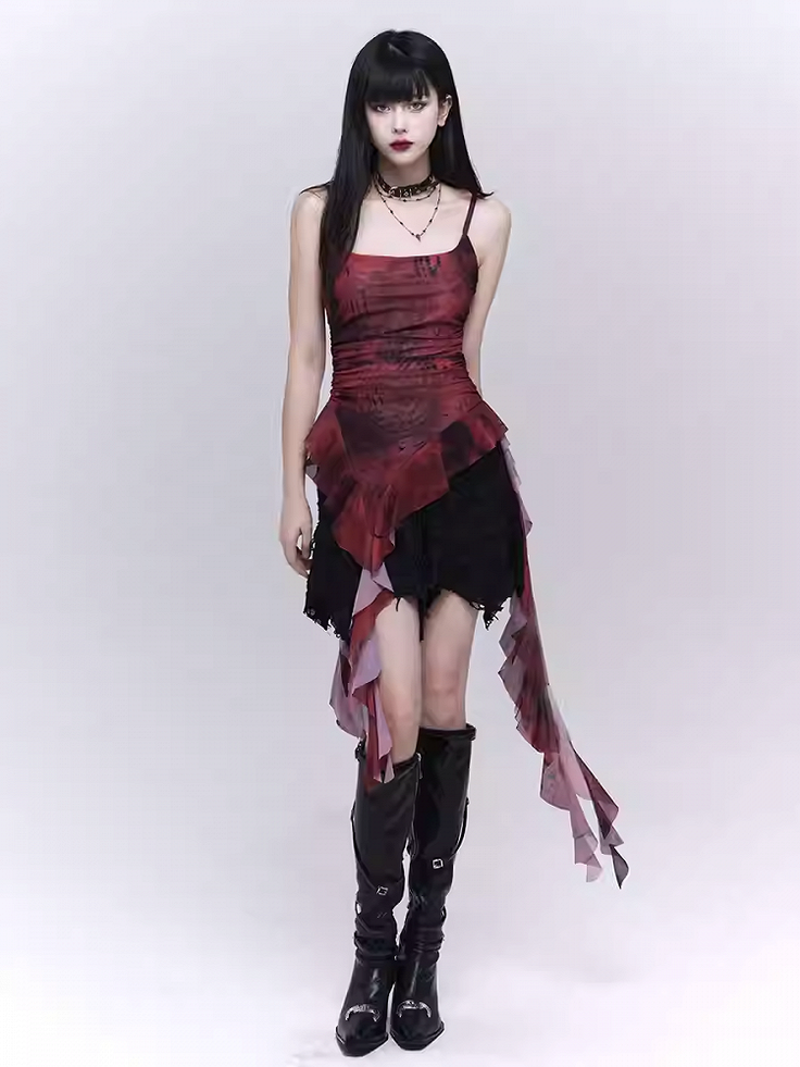 Woman with long black hair in a gothic mini dress and black boots