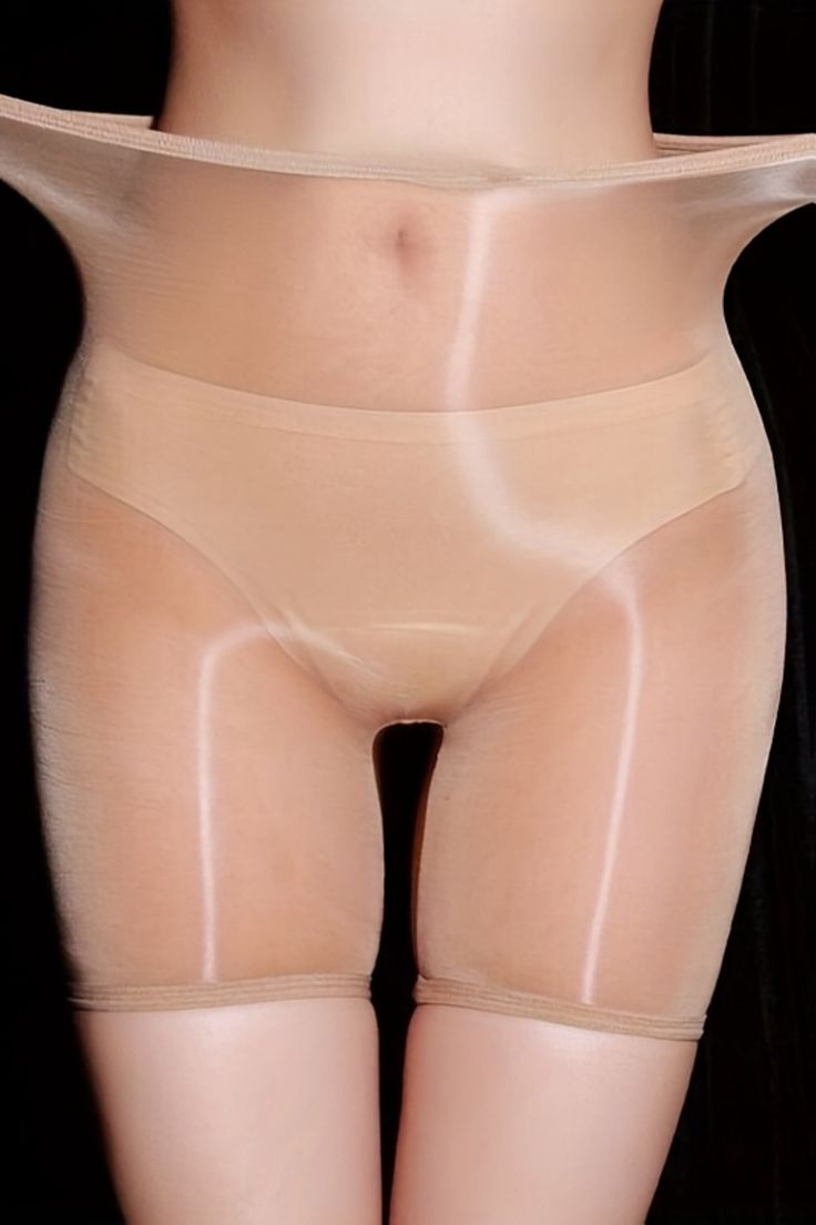 Lower torso and thighs in sheer, light-colored underwear with exposed skin