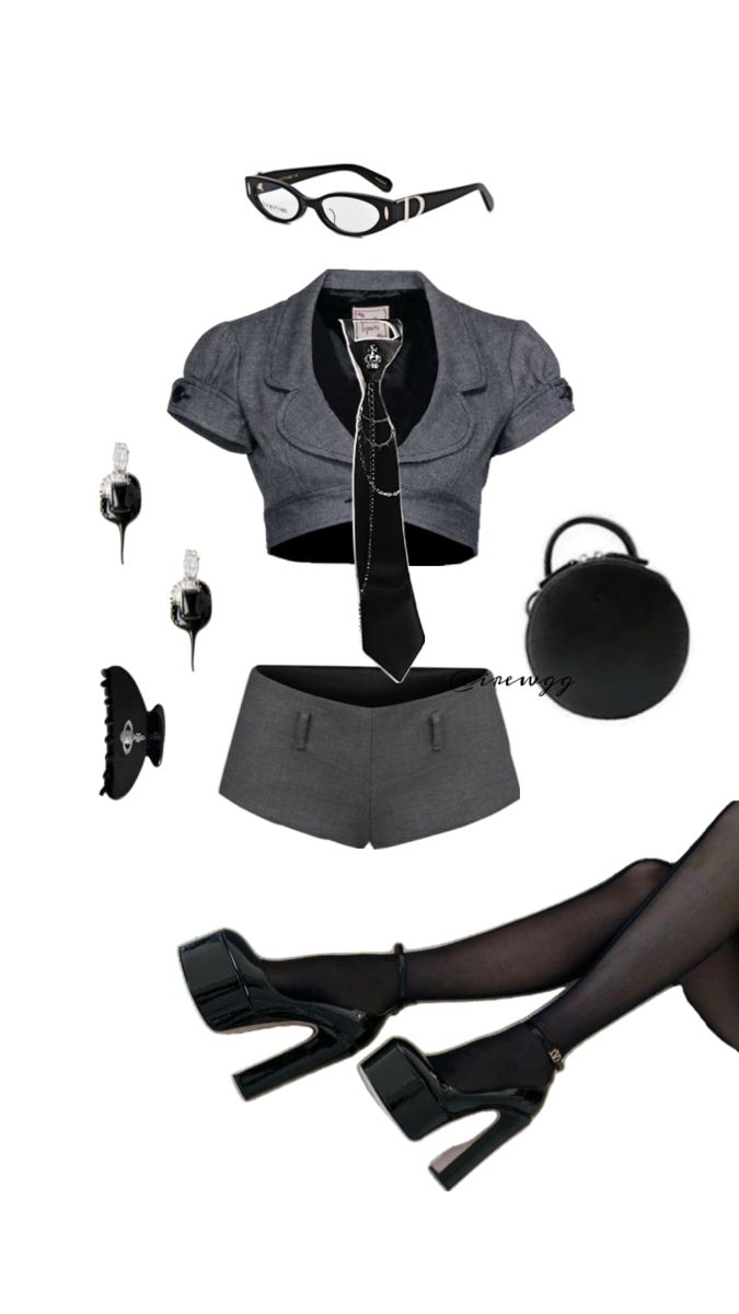Flat lay of a gray cropped blazer, mini shorts, and black accessories