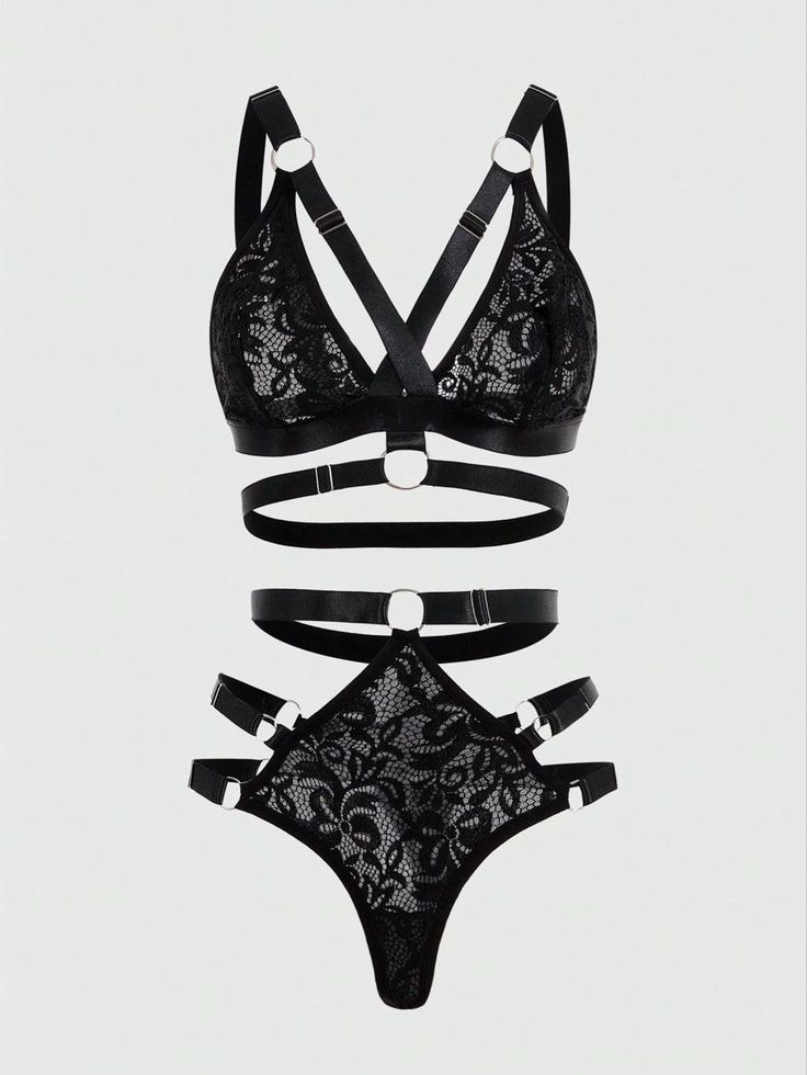Black lace lingerie set with strappy details and silver rings