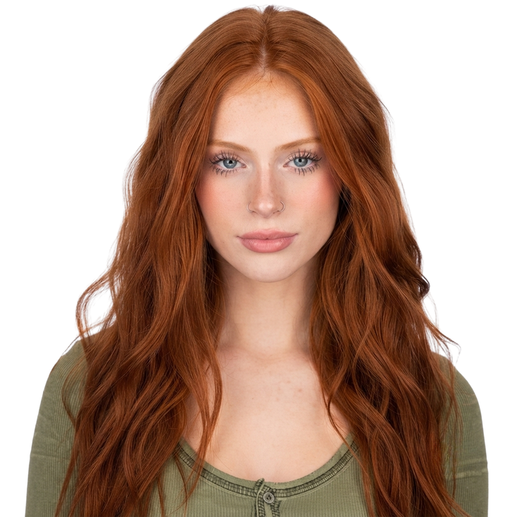 Woman with long red hair and blue eyes wearing a green shirt