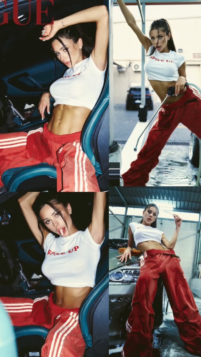 Woman in a white crop top and red pants posing at a car wash