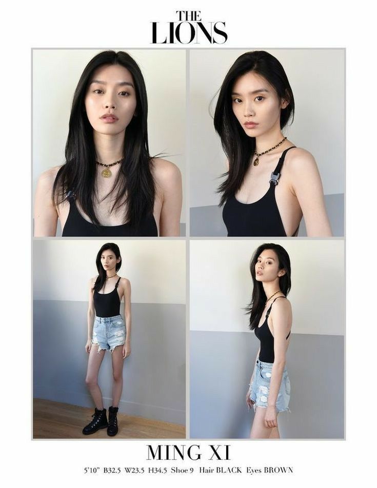 Woman with long black hair in a black tank top and denim shorts in a studio