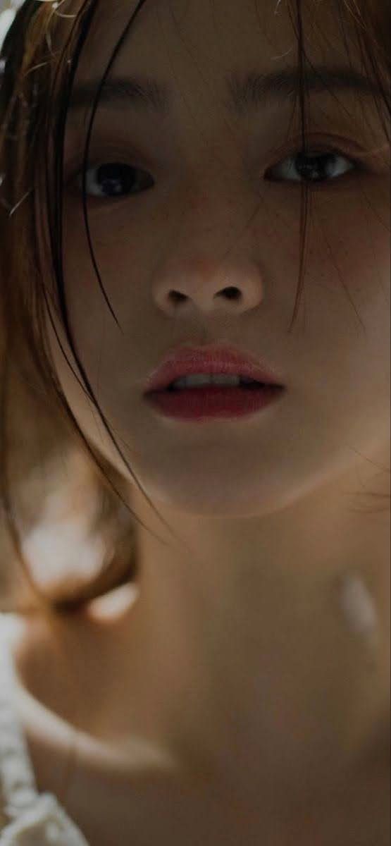 Close up portrait of a person with wet hair and red lips