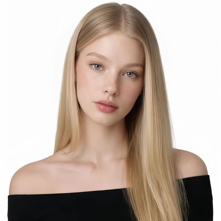 Young woman with long blonde hair and blue eyes wearing an off-shoulder top