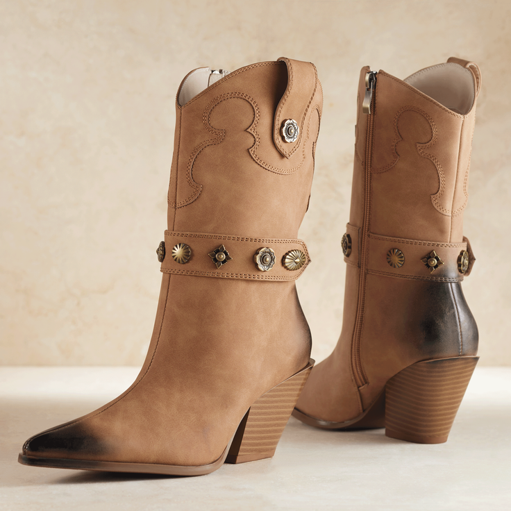Pair of tan leather cowboy boots with decorative studs and block heels