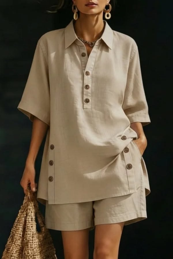 Woman in a beige linen shirt and shorts holding a straw bag