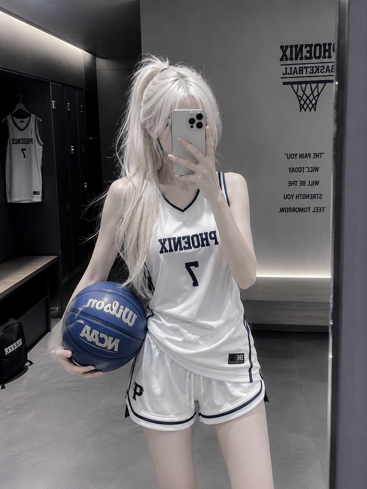 Woman in a white basketball uniform holding a blue basketball in a locker room