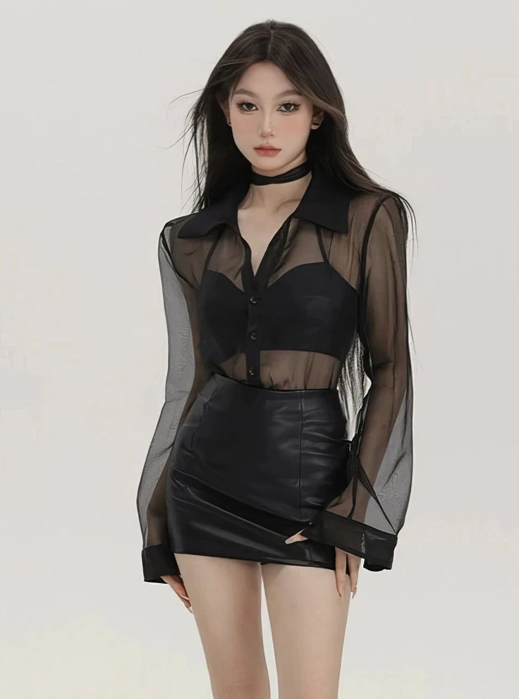 Woman in a black sheer shirt and leather skirt with a choker