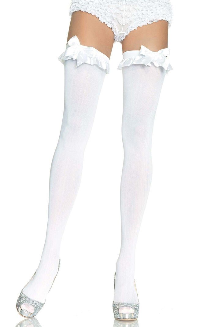 Woman wearing white thigh highs with ruffle trim and lace underwear