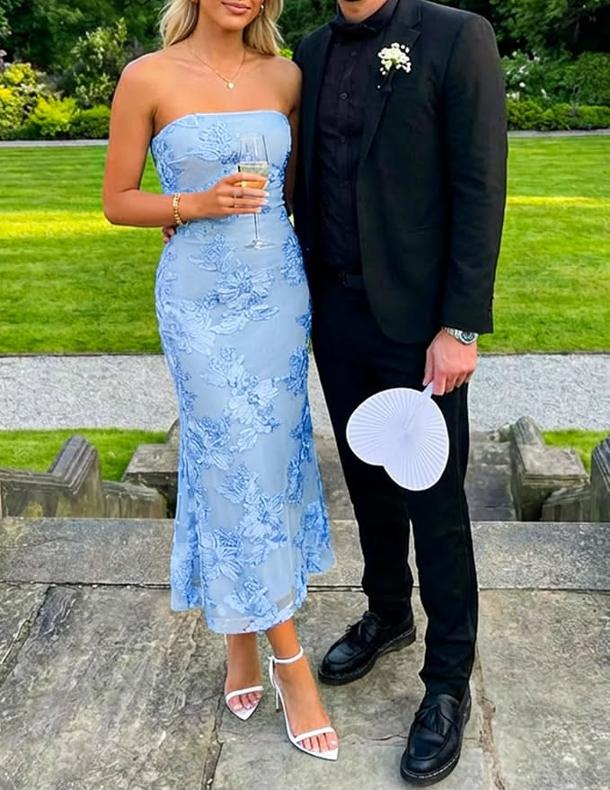 Couple dressed in formal wear standing outdoors on stone steps