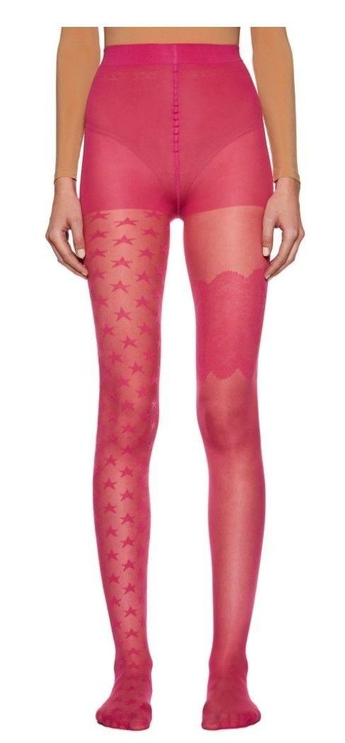 Person wearing sheer pink tights with star pattern and lace detail