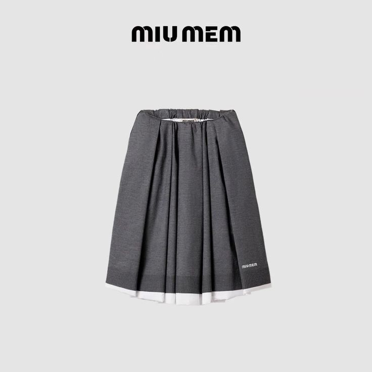 Gray pleated skirt with white trim on a plain background