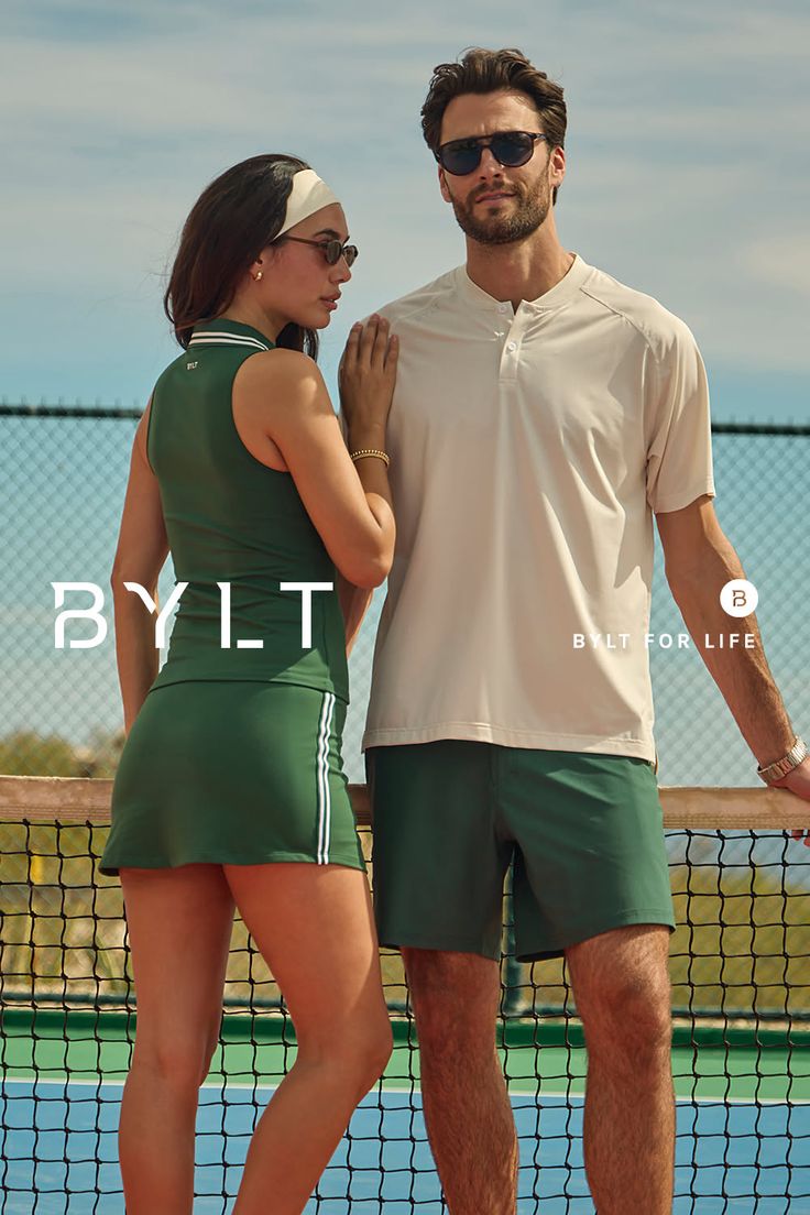Couple in athletic wear on a tennis court during the daytime
