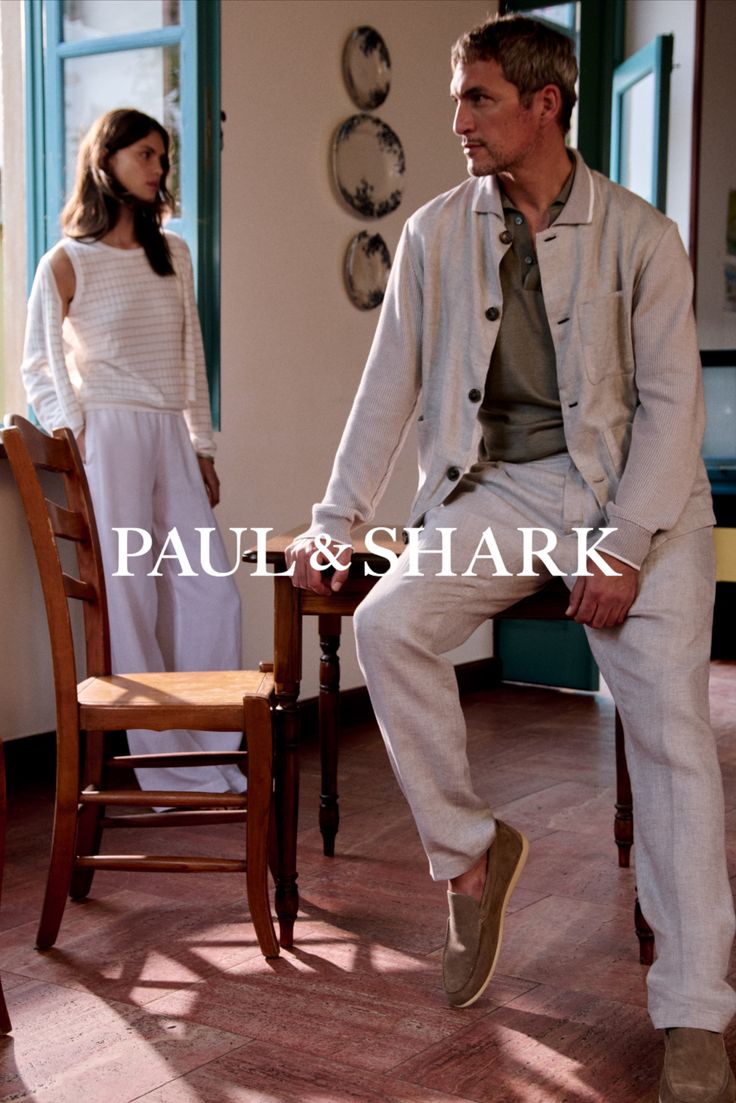 Two people in casual clothing indoors with natural lighting