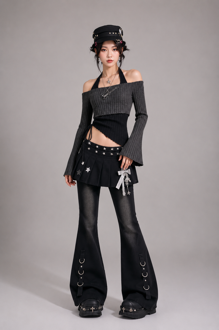 Woman in a dark aesthetic outfit with an off-shoulder top and bell-bottom pants
