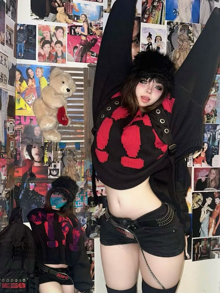 Person in a cropped sweater and short shorts with arms raised in an indoor setting