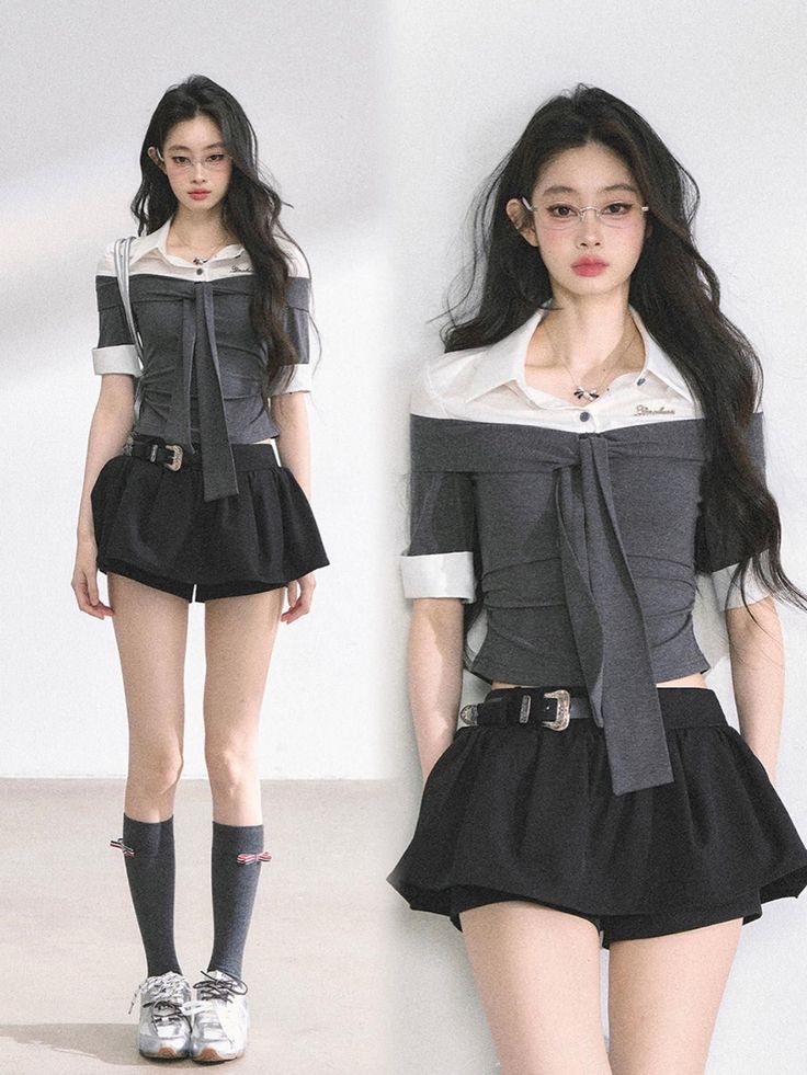 Woman with long black hair wearing an off-shoulder top and black shorts