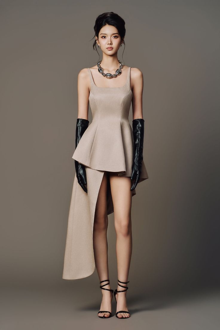 Woman in a beige dress with long gloves and high heels in a studio