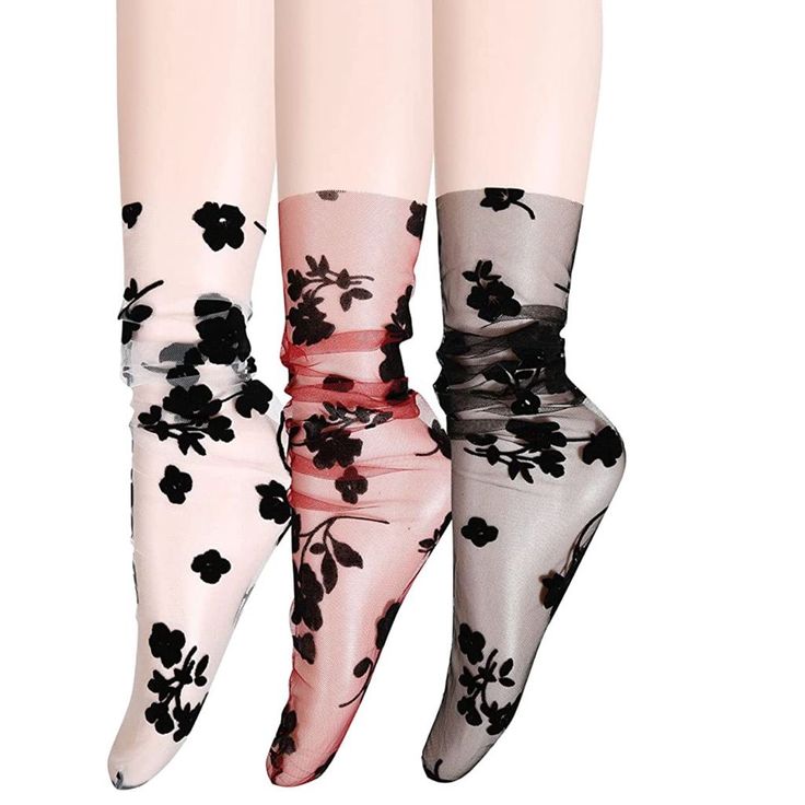 Three pairs of sheer ankle socks with black floral patterns