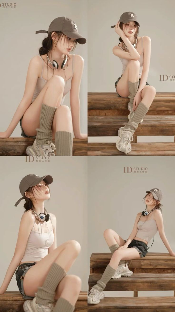 Woman in a tank top, denim shorts, and leg warmers sitting indoors