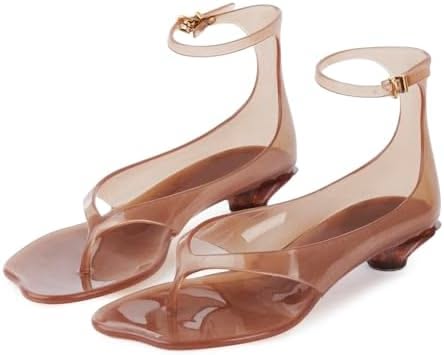 Pair of brown clear plastic jelly sandals with ankle straps and low heels