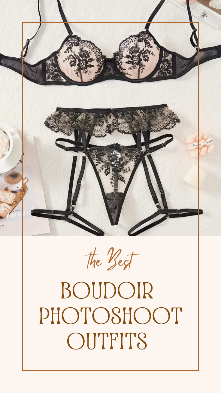 Black lace lingerie set with a bra, garter belt, and thong on a white surface