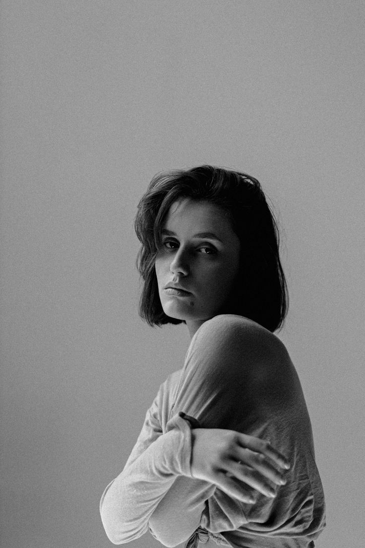 Woman with short hair in a black and white studio portrait