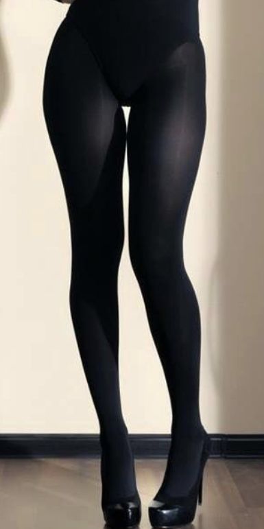 Person wearing black tights and high heels indoors