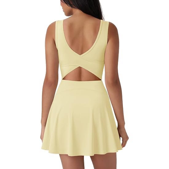 Woman in a yellow cut-out dress from the back