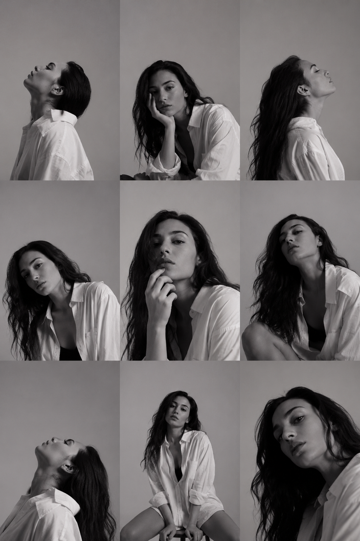Woman with long hair in a white shirt posing in a studio