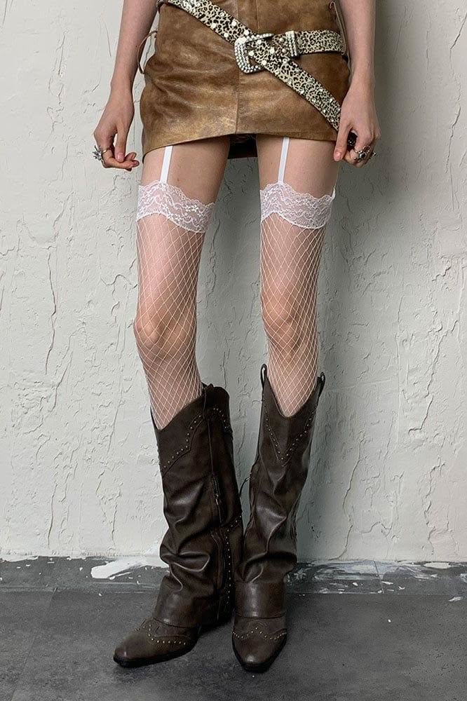 Person wearing a leather skirt, fishnet stockings, and cowboy boots