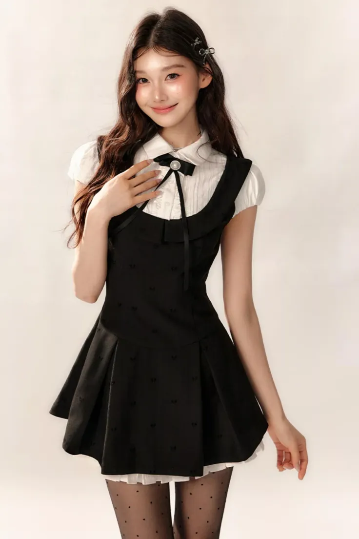 Woman in a black dress over a white shirt with polka dot tights
