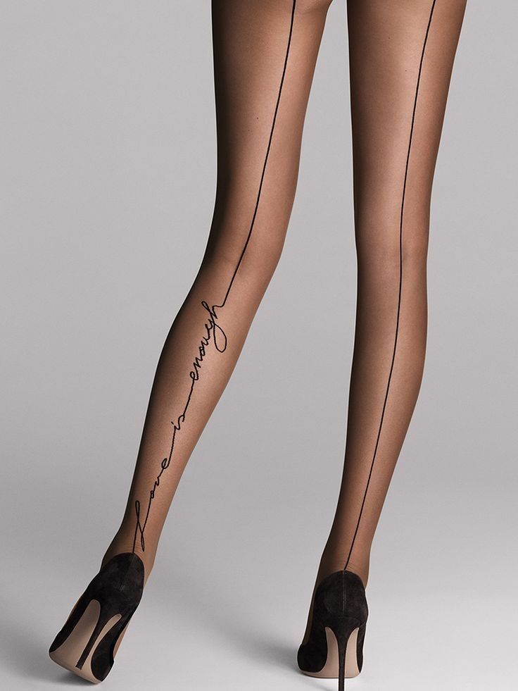 Woman's legs in sheer tights with a text design and high heels