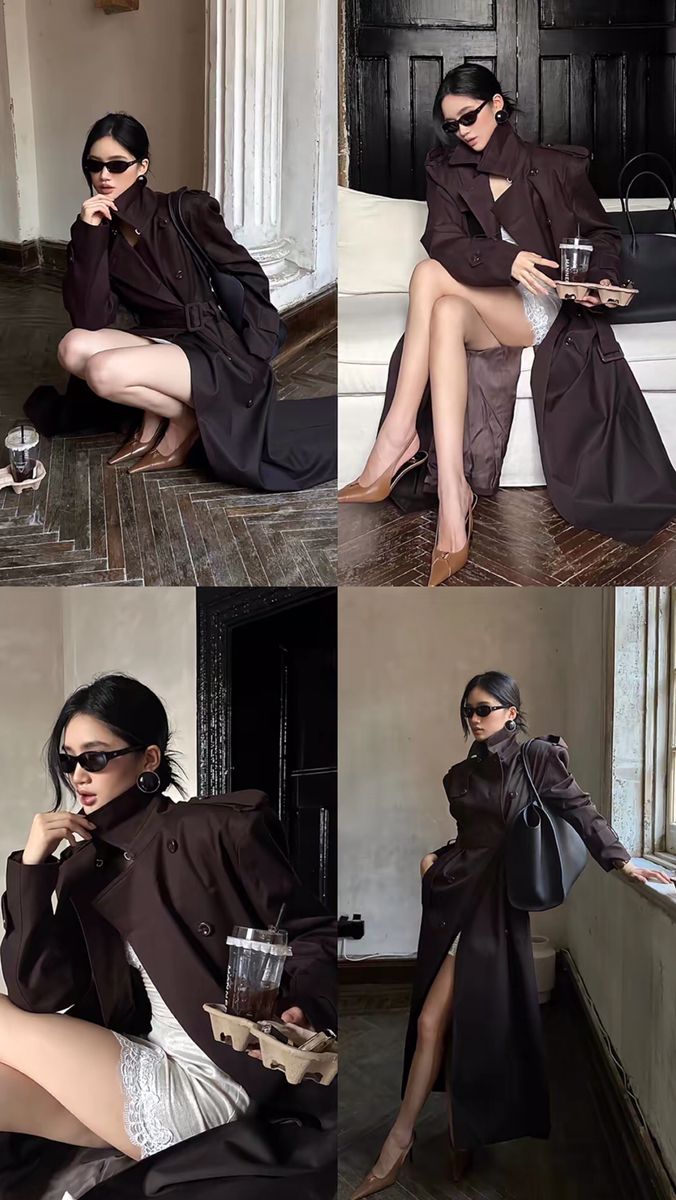 Woman in a dark trench coat and sunglasses posing indoors
