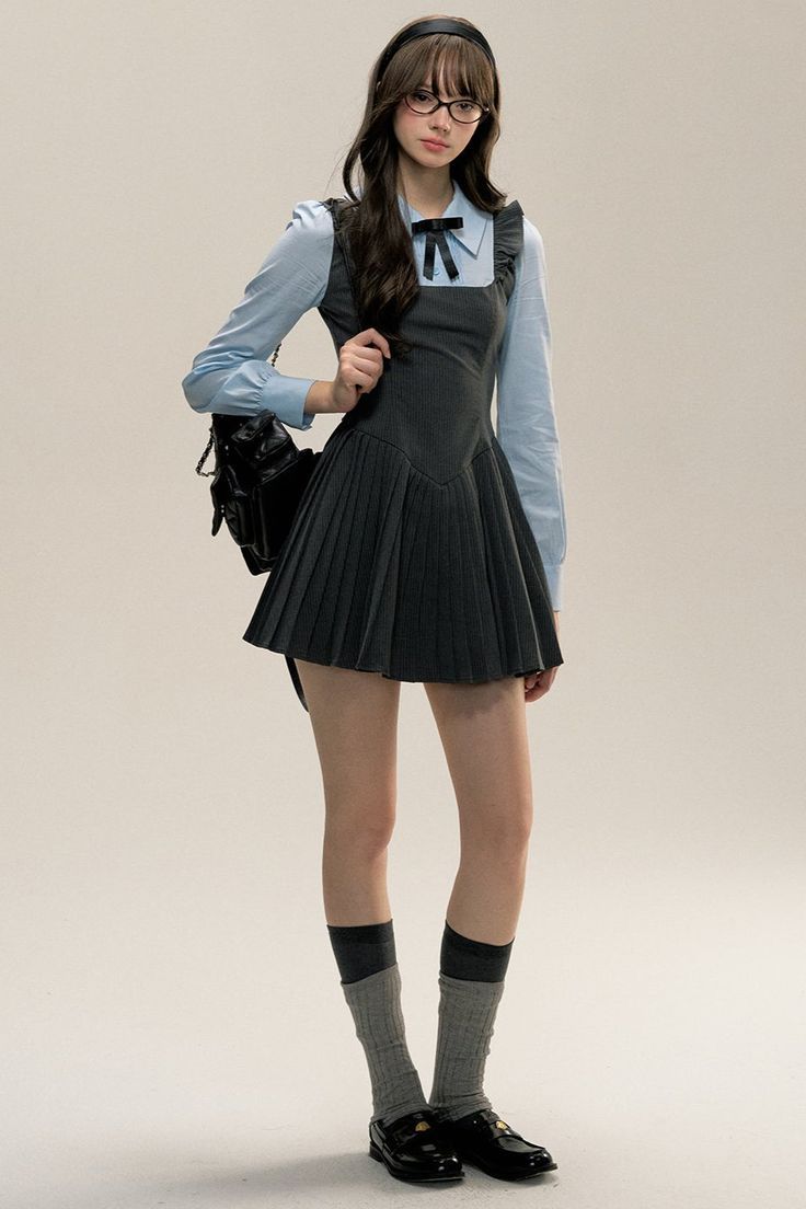 Woman in a school uniform with glasses and a black backpack