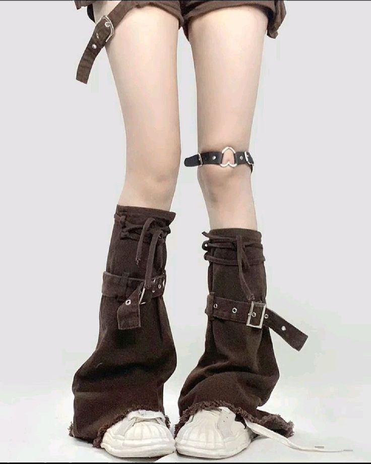 Person wearing brown leg warmers, white sneakers, and a knee garter