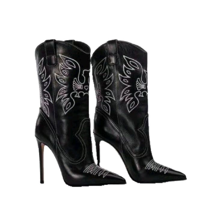 Pair of black leather cowboy boots with white stitching and high heels